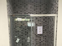 Staff shower room tiled by A and M Tiling Ltd